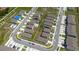 Bird's eye view of homes with fenced yards and a community pool nestled among townhomes at 2211 Tay Wes Dr, St Cloud, FL 34771