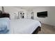 Cozy bedroom featuring a large bed, access to a bathroom, and a mounted television at 2211 Tay Wes Dr, St Cloud, FL 34771