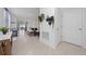 Inviting entryway featuring tile flooring, neutral walls, and decorative wall hangings, perfect for a warm welcome at 2211 Tay Wes Dr, St Cloud, FL 34771