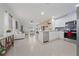 Open concept living space showcasing a modern kitchen, and seating area, designed for seamless entertaining and everyday living at 2211 Tay Wes Dr, St Cloud, FL 34771