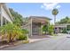 Charming home featuring a covered entrance, lush landscaping, and brick paved driveway and walkway to the front door at 2343 St George Dr, Davenport, FL 33837