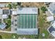 Overhead shot showcasing the six shuffleboard courts, with an overhead covering and seating areas for relaxing at 2343 St George Dr, Davenport, FL 33837