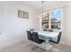 Modern dining room featuring a sleek white table, stylish chairs, and a large window at 2668 Coachman Dr, Deltona, FL 32738