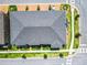 Aerial view of a home featuring a well-maintained roof, landscaping, and paved walkways at 2698 Chantilly Ave, Kissimmee, FL 34741