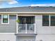 Charming balcony with white railing, providing a delightful outdoor space and view of the neighborhood at 2698 Chantilly Ave, Kissimmee, FL 34741