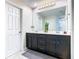 Bathroom with a double sink vanity and a large mirror at 2698 Chantilly Ave, Kissimmee, FL 34741