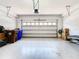 Spacious two-car garage with sealed floor and storage shelving at 2698 Chantilly Ave, Kissimmee, FL 34741