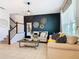 Comfortable living room featuring modern furniture, a decorative accent wall, and bright natural light at 2698 Chantilly Ave, Kissimmee, FL 34741