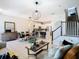 Spacious and inviting living area with an open layout, connecting to the dining and kitchen spaces at 2698 Chantilly Ave, Kissimmee, FL 34741