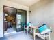 Inviting patio with comfortable seating, perfect for relaxing and enjoying the outdoor view through sliding glass doors at 2698 Chantilly Ave, Kissimmee, FL 34741