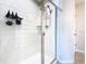 Glass door enclosed tiled shower with shelving and dual shower heads at 2698 Chantilly Ave, Kissimmee, FL 34741