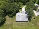 Aerial view of a home with a well-manicured lawn and mature trees at 2700 Cherokee Rd, St Cloud, FL 34772