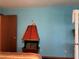 Unique fireplace design on a bedroom wall with a decorative mantle above it at 2700 Cherokee Rd, St Cloud, FL 34772