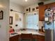 Kitchen desk area with window, wooden chair and stainless steel refrigerator at 2700 Cherokee Rd, St Cloud, FL 34772
