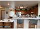 Bright, open kitchen with eat in bar and wood cabinetry at 2700 Cherokee Rd, St Cloud, FL 34772