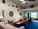 Spacious living area with vaulted ceilings and access to a sunroom at 2700 Cherokee Rd, St Cloud, FL 34772