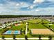 Aerial view of neighborhood amenities including park, sports courts and green space at 2759 Slash Way, St Cloud, FL 34771
