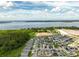 Aerial view of a residential neighborhood with a lake in the background at 2759 Slash Way, St Cloud, FL 34771