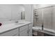 Modern bathroom featuring a walk-in shower with glass door, a spacious vanity, and neutral tones at 2759 Slash Way, St Cloud, FL 34771