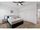 Relaxing bedroom with a comfortable bed, neutral decor, and double door closets at 2759 Slash Way, St Cloud, FL 34771