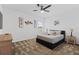 Comfortable bedroom featuring a cozy queen bed and a ceiling fan at 2759 Slash Way, St Cloud, FL 34771