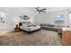 Expansive primary bedroom suite with plush carpet, seating area, and decor at 2759 Slash Way, St Cloud, FL 34771