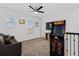 Loft area with a Pac-Personal arcade game, a ceiling fan, and comfortable seating at 2759 Slash Way, St Cloud, FL 34771