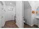Bright entryway with wood floors leading to a half bathroom, offering style and convenience at 2759 Slash Way, St Cloud, FL 34771