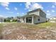 Two-story home featuring a covered patio and a spacious backyard at 2759 Slash Way, St Cloud, FL 34771