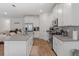 Stylish kitchen with white cabinets, stainless appliances, and a spacious gray countertop island at 2759 Slash Way, St Cloud, FL 34771