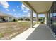 Covered patio area featuring concrete flooring, exterior view and grassy yard at 2759 Slash Way, St Cloud, FL 34771