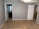 This bedroom features neutral walls, carpet flooring, and two doors leading to the bathroom and closet at 2940 Tanzanite Ter, Kissimmee, FL 34758