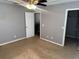This bedroom features neutral walls, carpet flooring, ceiling fan, and ample closet space at 2940 Tanzanite Ter, Kissimmee, FL 34758