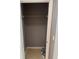 This closet offers shelving with a neutral wall paint and tile flooring that adds functionality and visual appeal at 2940 Tanzanite Ter, Kissimmee, FL 34758