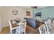 Comfortable living room seamlessly connected to the dining area, perfect for relaxing and entertaining guests at 2993 Caribbean Soul Dr, Kissimmee, FL 34747