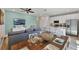 Spacious open-concept living space with modern appliances, a view of the lake, and stylish furnishings throughout at 2993 Caribbean Soul Dr, Kissimmee, FL 34747