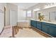 Bright and spacious bathroom featuring double vanity, soaking tub, and stylish fixtures at 301 Terranova Blvd, Winter Haven, FL 33884