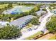 Beautiful community aerial shot featuring a pool, a pond, and ample parking at 3111 Sun Lake Ct # B, Kissimmee, FL 34747