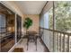 Relaxing screened balcony with a table and chairs, perfect for enjoying the outdoors at 3111 Sun Lake Ct # B, Kissimmee, FL 34747