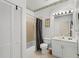 Well-lit bathroom with a shower-tub, tiled flooring, and single sink vanity at 3111 Sun Lake Ct # B, Kissimmee, FL 34747