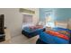bedroom featuring two twin beds and cartoon-themed comforters at 3111 Sun Lake Ct # B, Kissimmee, FL 34747