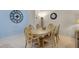 Elegant dining area with a wooden table set for six, complemented by stylish decor at 3111 Sun Lake Ct # B, Kissimmee, FL 34747
