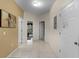 Hallway with three doors and tile floor leading to other rooms in the home at 3111 Sun Lake Ct # B, Kissimmee, FL 34747