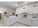 Well-lit kitchen equipped with white countertops and cabinetry, perfect for home cooking at 3111 Sun Lake Ct # B, Kissimmee, FL 34747