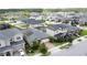 Aerial view of neighborhood homes featuring well-maintained lawns and solar panels at 3193 Crispin Cir, Harmony, FL 34773