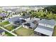 Aerial view of neighborhood homes with solar panels, green lawns, and fenced backyard at 3193 Crispin Cir, Harmony, FL 34773