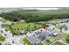 Neighborhood aerial view showcases park, lake, and homes, pinpointing a home in the community at 3193 Crispin Cir, Harmony, FL 34773