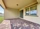 Covered back patio features a brick floor and leads to a well-maintained backyard at 3193 Crispin Cir, Harmony, FL 34773