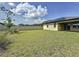 Large, green backyard with a white fence offers privacy and space for outdoor activities at 3193 Crispin Cir, Harmony, FL 34773