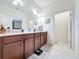 Bright bathroom featuring a double sink vanity and a well-lit, spacious layout at 3193 Crispin Cir, Harmony, FL 34773